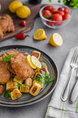 Schnitzel original with lemon and gnocchi fried