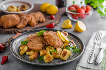 Schnitzel original with lemon and gnocchi fried