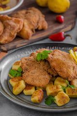 Schnitzel original with lemon and gnocchi fried
