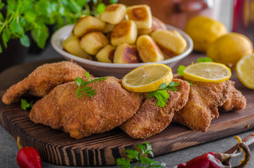 Schnitzel original with lemon and gnocchi fried