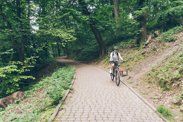 woman riding bike in city park