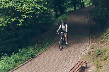 woman riding bike in city park