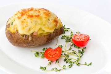 Jacket, baked potato -ham and cheese, macro, close up at restaurant