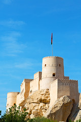 in oman muscat rock  the old defensive  fort battlesment sky and  star brick
