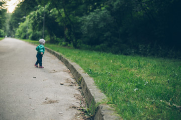 1 year old baby walking by park