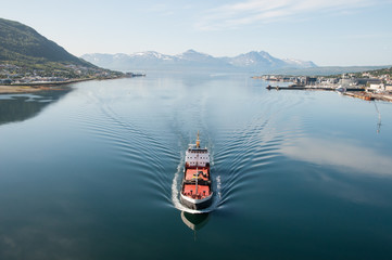 Ship in Tromsö, Norway, with panorama view to mountains in the background © KIS