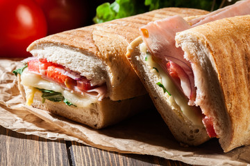 Toasted panini with ham, cheese and arugula sandwich