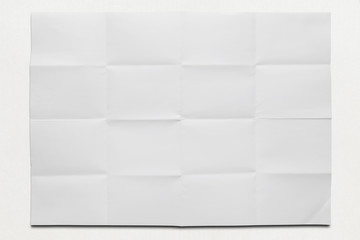 white glossy paper folded in sixteen