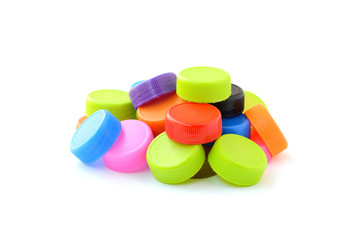 pile of colorful plastic bottle cap on white background