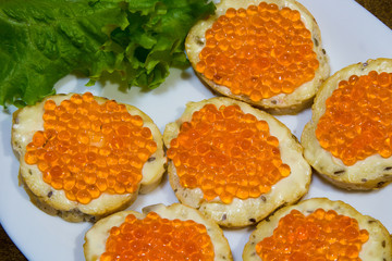 Delicious sandwiches with red caviar. Fresh bread for Breakfast.