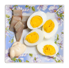 Delicious breakfast, boiled eggs, herring and mayonnaise