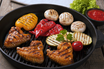Chicken wings grill with grilled vegetables