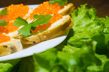 Delicious sandwiches with red caviar. Fresh bread for Breakfast.