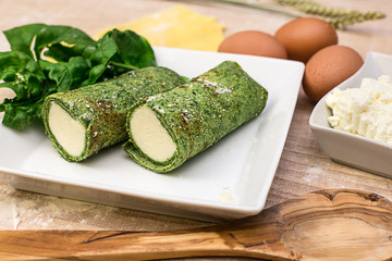crepes stuffed with spinach and fresh cheese