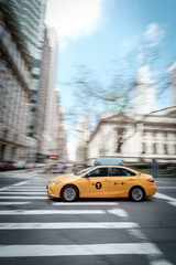 Fototapeta na wymiar Fast New York Taxi Cab driving through Manhattan