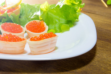 Delicious sandwiches with red caviar. Fresh bread for Breakfast.