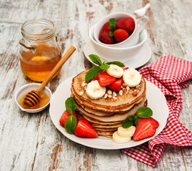 Pancakes with strawberries and bananas