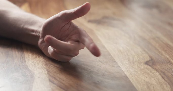 Young man hand finger count at the table