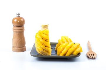 slices and peeled pineapple fruit  on white