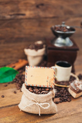 spilled coffee beans in bag on wooden table