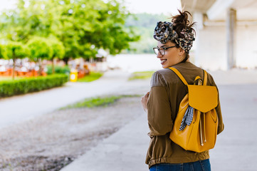 Portrait of young beautiful caucasian brunette woman outdoor in the city