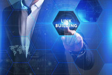 Business, Technology, Internet and network concept. Young businessman working on a virtual screen of the future and sees the inscription: Link building