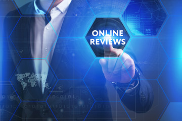 Business, Technology, Internet and network concept. Young businessman working on a virtual screen of the future and sees the inscription: Online reviews