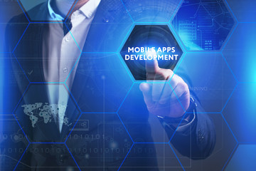 Business, Technology, Internet and network concept. Young businessman working on a virtual screen of the future and sees the inscription: Mobile apps development