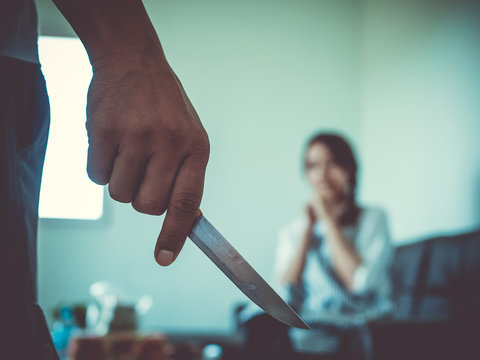 Man carrying a knife threatens a young woman.