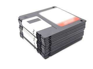 Stack of old storage, diskette, floppy disk on white background