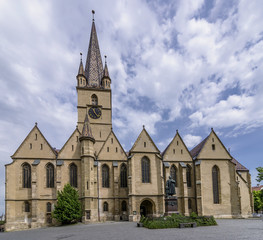 Obraz premium The Lutheran Cathedral of Saint Mary, Sibiu, Romania, against a beautiful sky