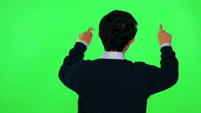 An Asian man works on an interactive board - green screen studio