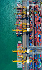 container ship in import export and business logistic.By crane ,Trade Port , Shipping, cargo to...