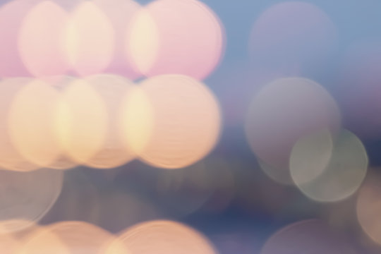Colorful bokeh blur background from traffic light at twilight time.