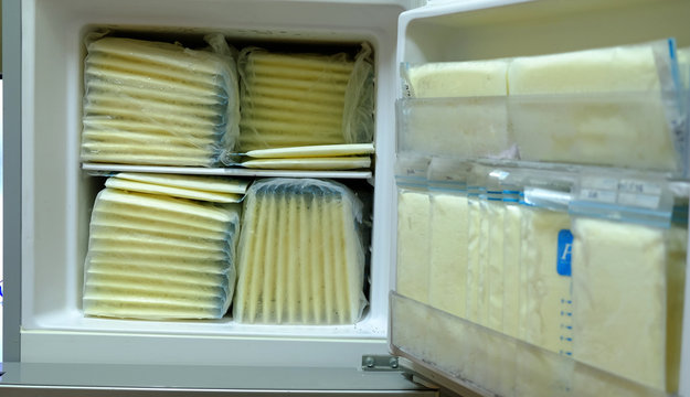 Frozen breast milk in storage bags for baby in refrigerator