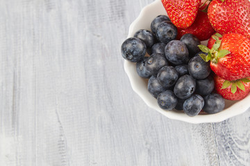 Berries on a gray wooden background