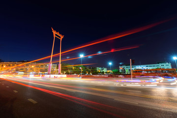 Fototapeta na wymiar Moving blur light around the Giant swing landmark in the city / Sao Ching Cha