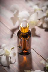 Obraz na płótnie Canvas Bottle of aroma essential oil or spa and natural fragrance oil
