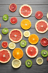 Fototapeta na wymiar Citrus slices on wooden background