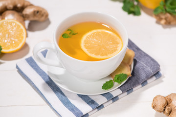 Healthy ginger tea ingredients on a wooden table