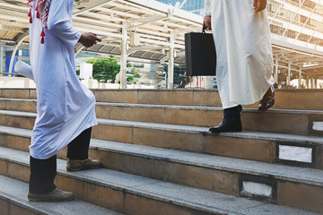 Arab businessman holding bag successful