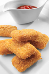 Cheese sticks and tomato sauce on plate