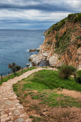 Fototapeta na wymiar Path on Mediterranean Sea Coastline in Catalonia, Spain
