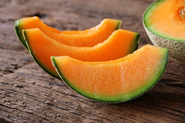 melons sliced Fresh on wooden table