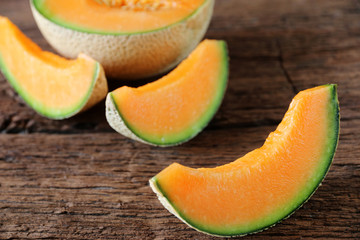 melons sliced Fresh on wooden table