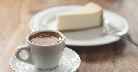 espresso and cheesecake on table