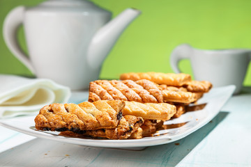 puff cookies with raisins on the plate