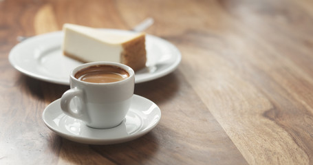 espresso and cheesecake on table