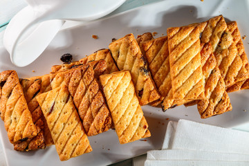 puff cookies with raisins on the plate
