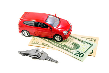 Red toy car with keys and money
